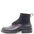 A black leather ankle boot with a low stacked heel, black laces, and contrast stitching, shown from a side profile on a white background.