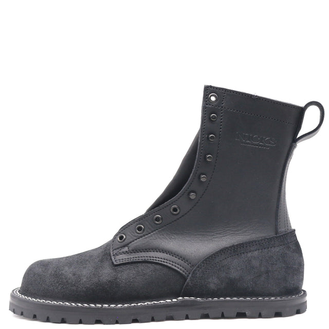 A single black leather and suede ankle boot with metal eyelets, white contrast stitching, and a pull tab on the heel, shown from a side profile on a white background.