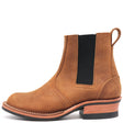 A single brown suede Chelsea boot with a black elastic side panel and a stacked wood-look heel, shown from a side profile on a white background.