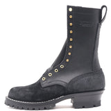 Tall black work boot with a lug outsole and brass hardware in front of a white background.
