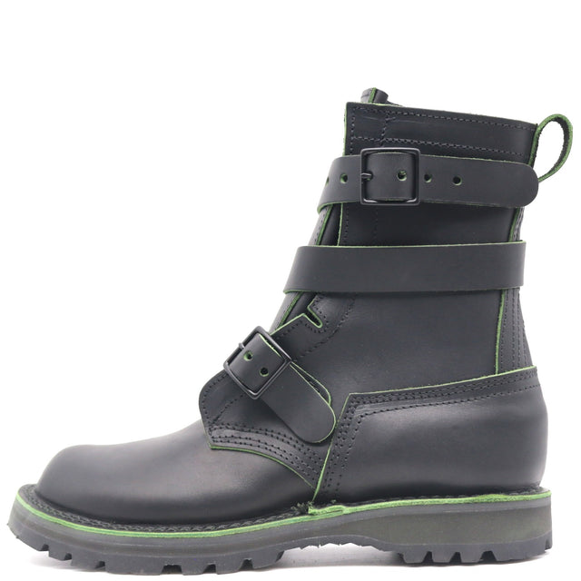 A black leather ankle boot with multiple adjustable straps and bright green contrast stitching, shown from a side profile on a white background.