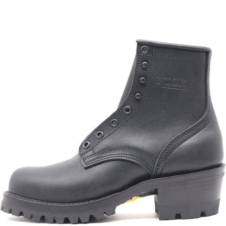 A black leather ankle boot with a chunky lug sole and a low block heel, featuring metal eyelets and a debossed 'KICKS' logo on the side, shown against a plain white background.