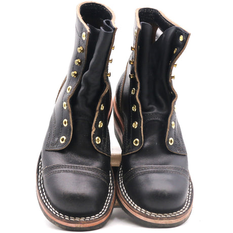 A pair of black leather lace-up ankle boots with gold-toned metal eyelets and studs, featuring contrast stitching around the toe and sole edge, photographed against a plain white background.