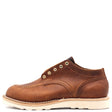 A single brown leather lace-up shoe with gold-tone eyelets and a thick off-white sole, shown in profile against a plain white background.