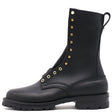 A black leather lace-up combat boot with gold-tone metal eyelets and studs, featuring a pull tab at the top, shown from a side profile on a white background.