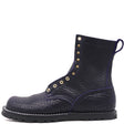 Black zero drop textured leather boot with purple leather core and black hardware in front of a white background.