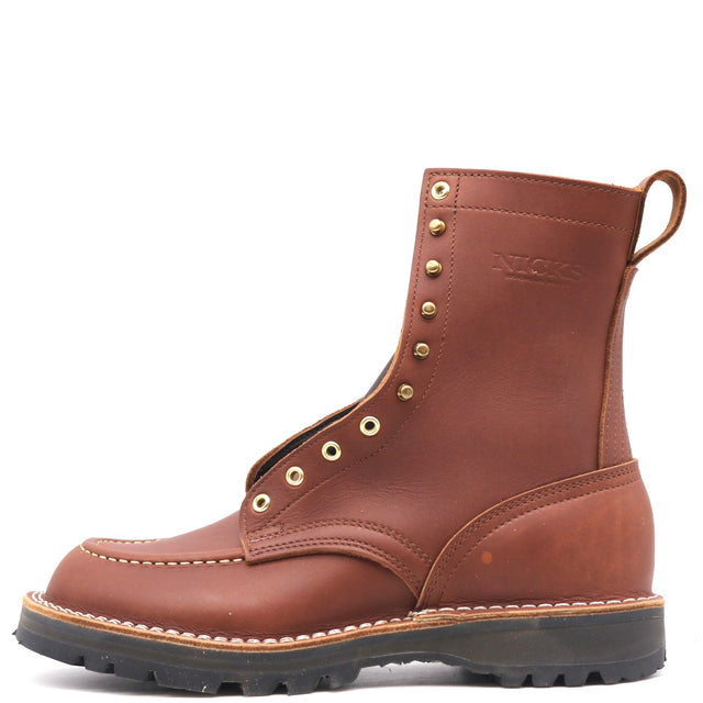 A brown leather work boot with brass eyelets, a pull tab, and a black lug sole, shown from a side profile on a white background.
