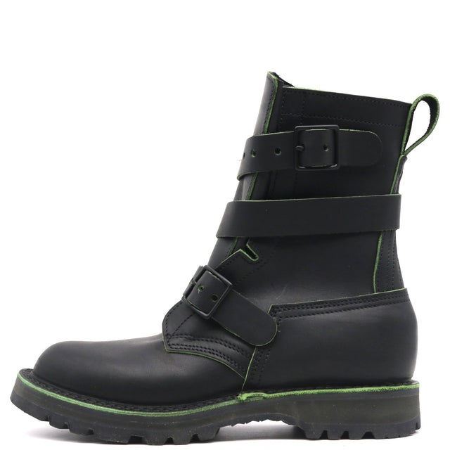 A black leather ankle boot with three adjustable strap closures and bright green contrast stitching, shown from a side profile on a white background.