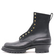 A black leather ankle boot with gold-tone metal eyelets and studs, a low chunky block heel, and a rugged lug sole, shown from a side profile on a white background.