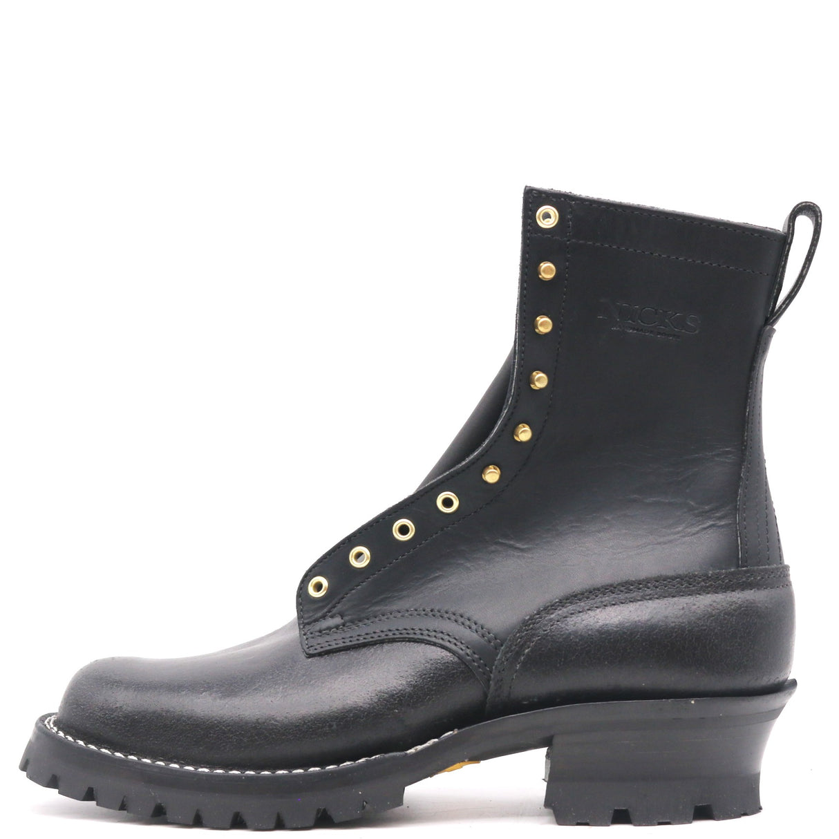 A black leather ankle boot with gold-tone metal eyelets and studs, a low chunky block heel, and a rugged lug sole, shown from a side profile on a white background.