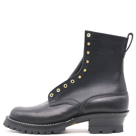 A black leather ankle boot with gold-tone metal eyelets and studs, a low chunky block heel, and a rugged lug sole, shown from a side profile on a white background.
