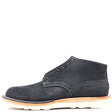 A single dark gray suede ankle boot with white contrast stitching, a light tan midsole, and a white outsole, shown from a side profile on a white background.