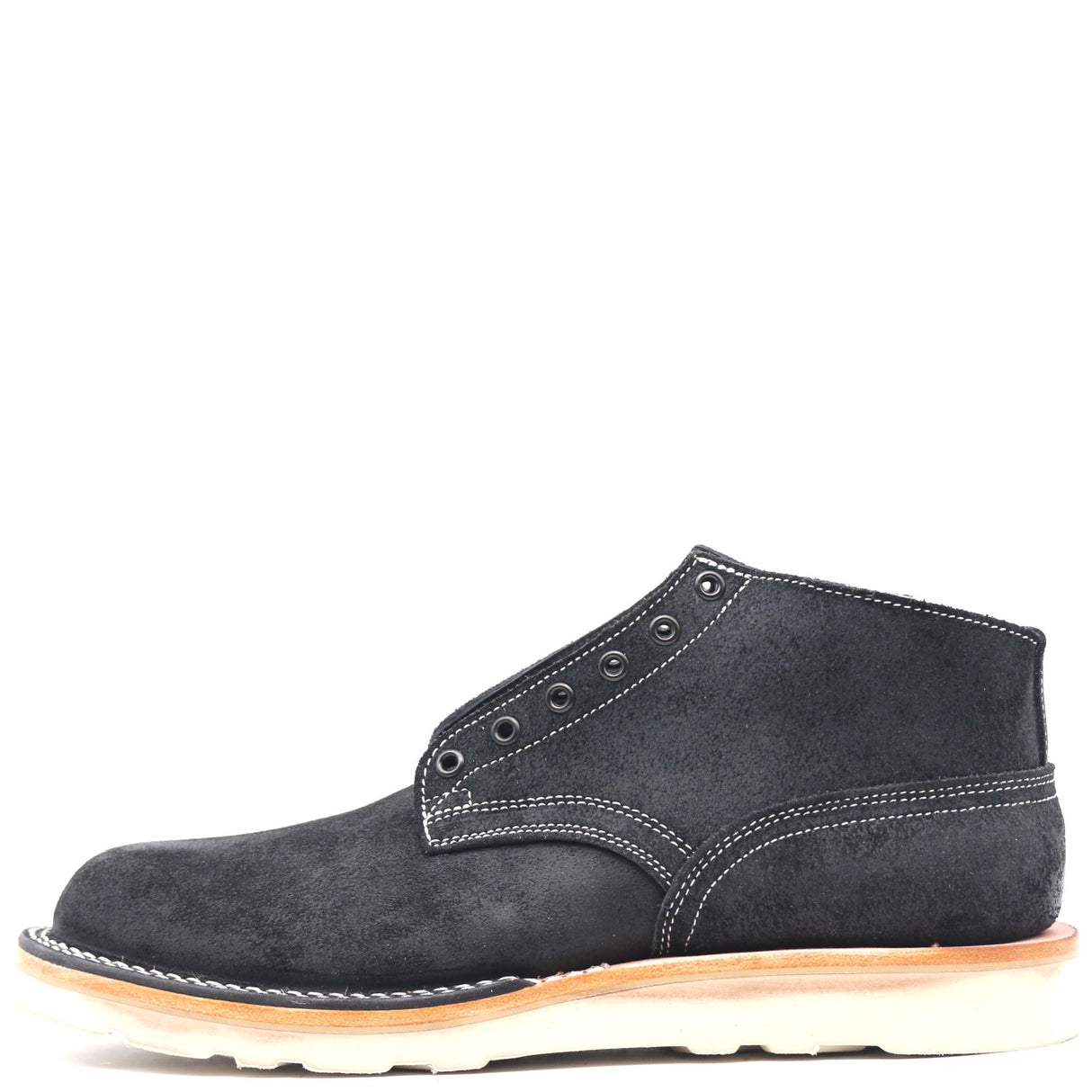 A single dark gray suede ankle boot with white contrast stitching, a light tan midsole, and a white outsole, shown from a side profile on a white background.