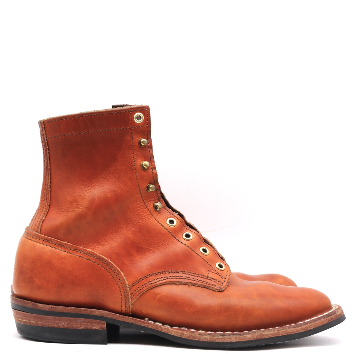 A single brown leather lace-up ankle boot with brass eyelets and a black sole, photographed from the side against a white background.