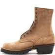 A single tan suede lace-up work boot with a dark brown lug sole and heel, shown from a side profile on a white background. The brand name 'NICKS' is embossed on the side collar.