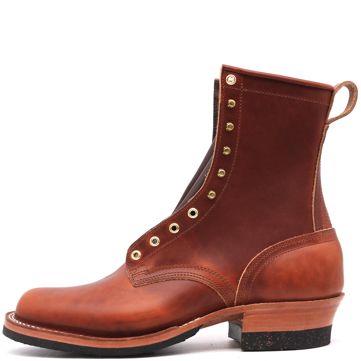 A brown leather lace-up ankle boot with brass eyelets, a low stacked heel, and a pull loop, shown from a side profile on a white background.