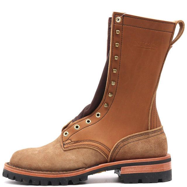 A single mid-calf work boot in brown leather and suede, featuring brass eyelets with metal studs, a pull tab, and a rugged black lug sole, shown against a plain white background.