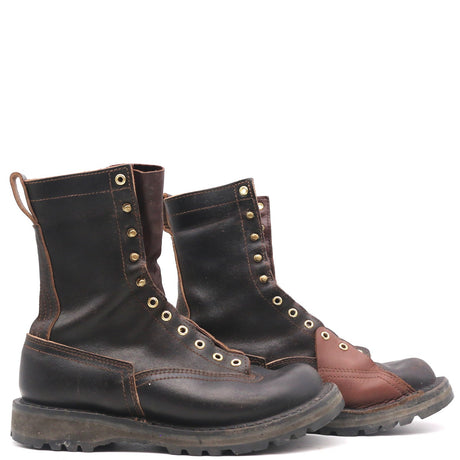 A pair of rugged dark brown leather lace-up boots with tan stitching and brass eyelets, shown against a plain white background.