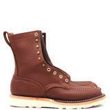 Brown eight inch boots with a white outsole and brass hardware in front of a white background.