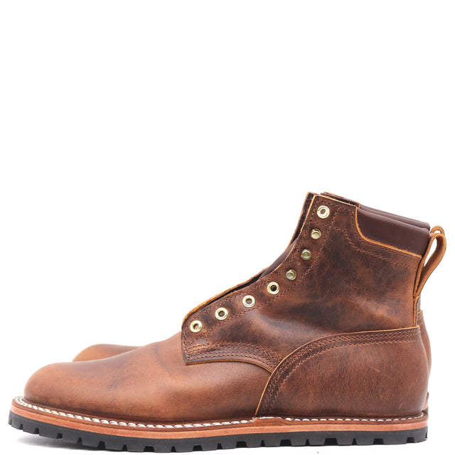 A pair of men's distressed brown leather lace-up ankle boots with brass eyelets and a black rubber sole, shown against a plain white background.
