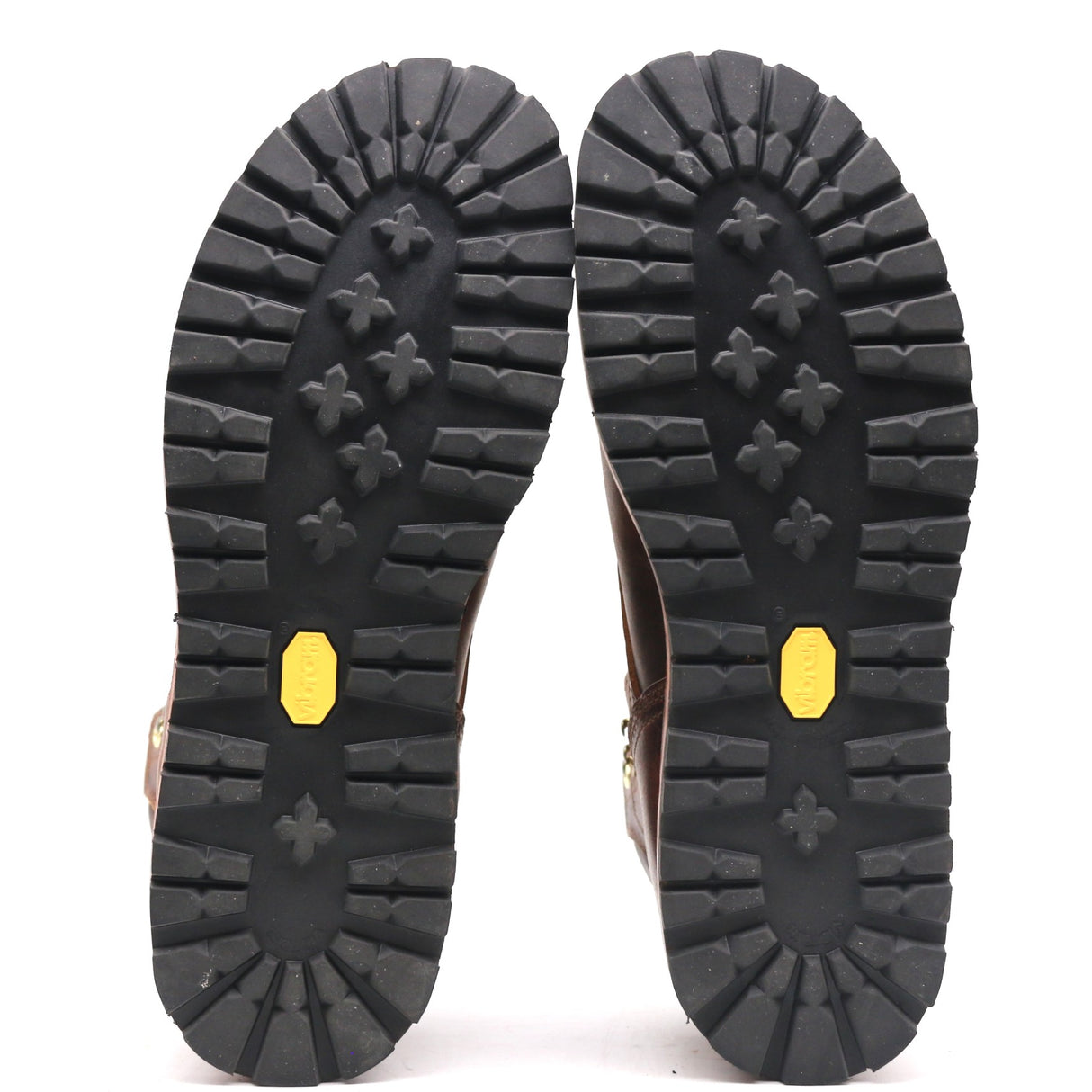 Photograph of a pair of black Kletterlift  flat outsoles in front of a white background.