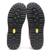 Photograph of a pair of black Kletterlift  flat outsoles in front of a white background.