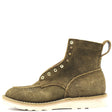 A single mid-calf suede boot in olive green with metal eyelets, contrast stitching, and a thick off-white sole, shown against a plain white background.