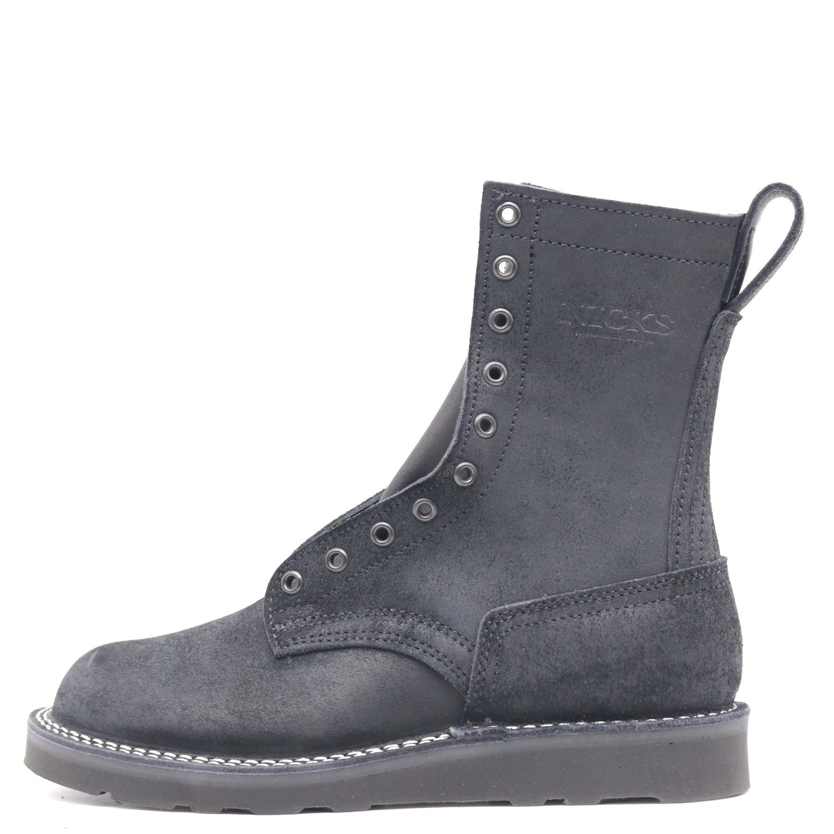 Black leather boot with a black wedge outsole, black hardware, a tactical heel counter and pull loop in front of a white background.