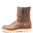 Light brown pull on boot with side pull loops and a white wedge outsole in front of a white background.