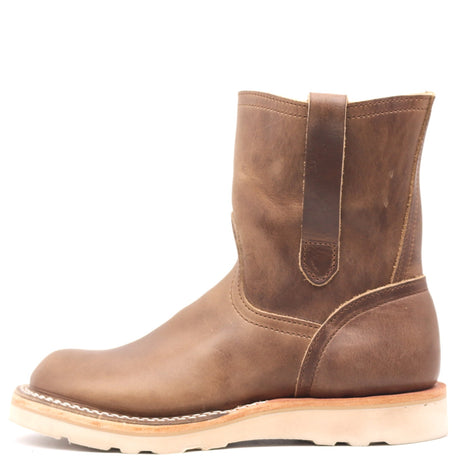 Light brown pull on boot with side pull loops and a white wedge outsole in front of a white background.