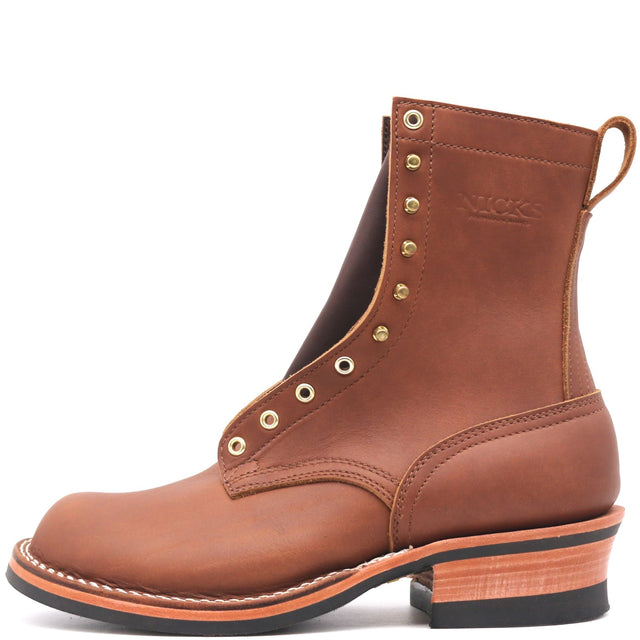 Tall brown leather boot with brass hardware in front of a white background.
