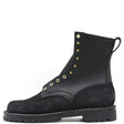 Black leather boot with a near zero drop unit lug outsole and brass hardware in front of a white background.