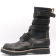 A black leather mid-calf boot with multiple adjustable straps and contrast stitching, shown from a side profile on a white background.