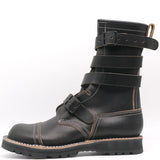 A black leather mid-calf boot with multiple adjustable straps and contrast stitching, shown from a side profile on a white background.