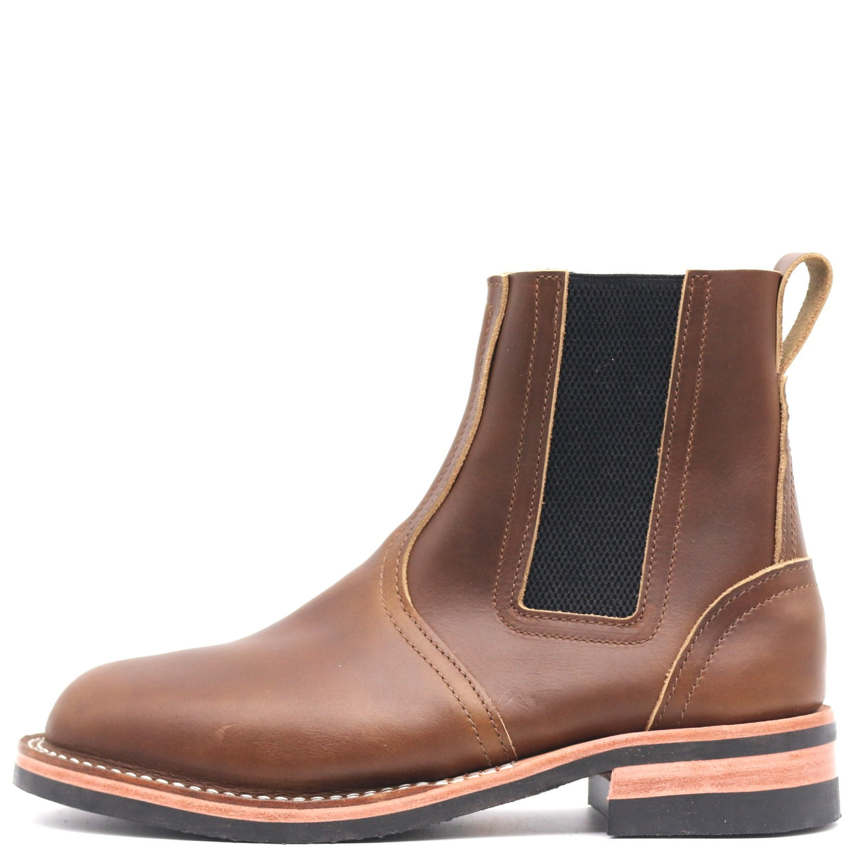 Brown pull on boot with pull loop and outside elastic band in front of a white background.