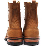 A pair of brown leather lace-up boots shown from the back, featuring pull tabs, decorative stitching, and thick black and brown soles, set against a plain white background.