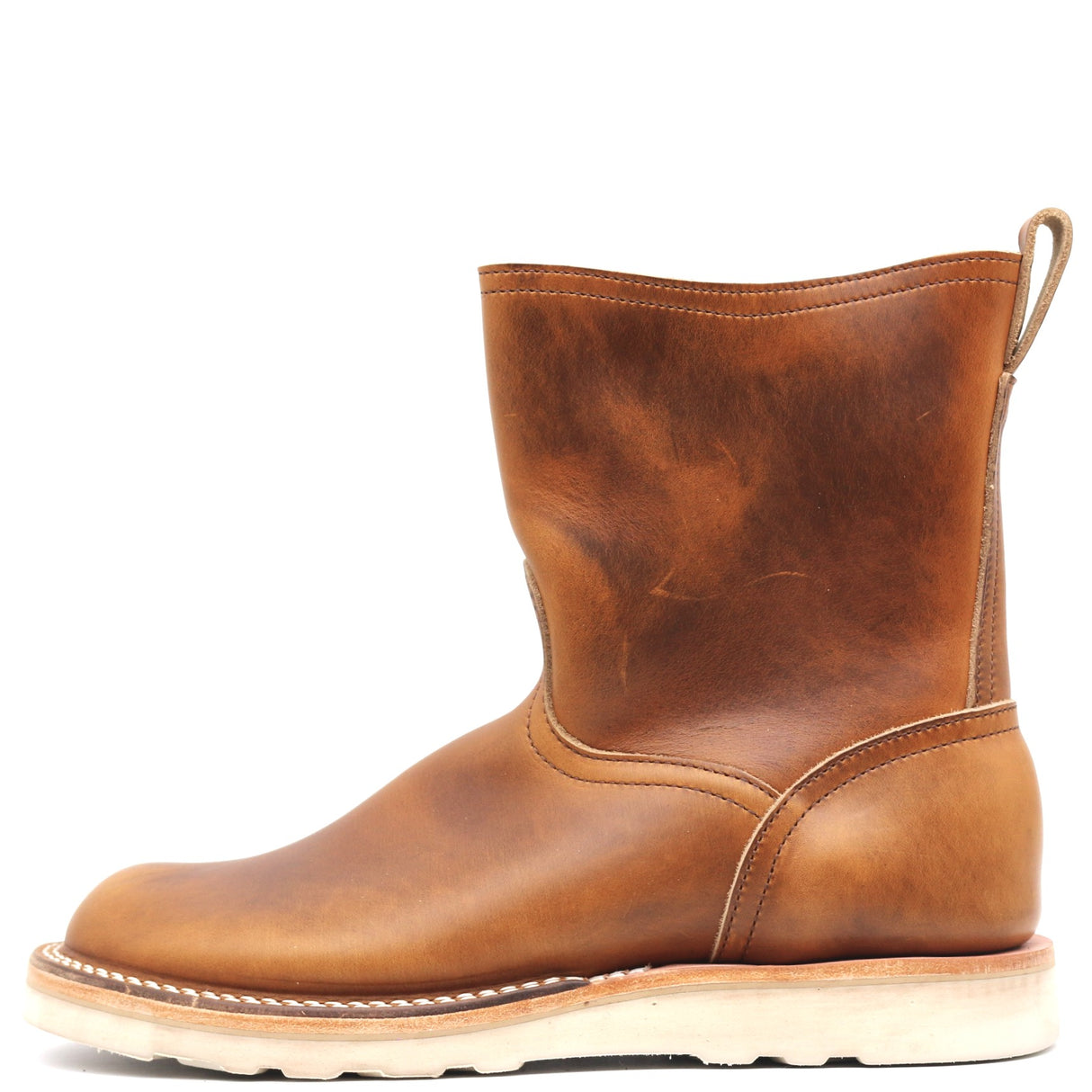 A single mid-calf leather boot in a warm cognac brown, shown in a side profile against a solid white background.
