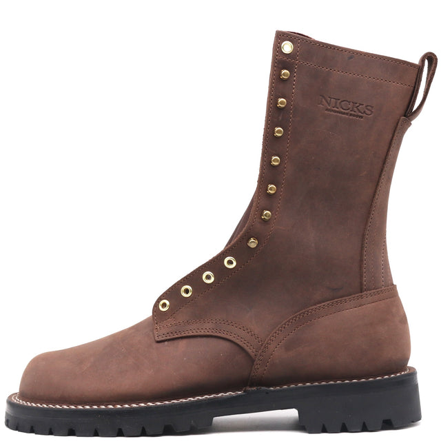 A brown leather lace-up work boot with brass eyelets, a black lug sole, and the brand name 'NICKS' embossed on the side, shown against a plain white background.