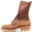 A tall brown leather and suede lace-up work boot with brass eyelets, a pull tab, and a chunky lug sole, shown on a plain white background.
