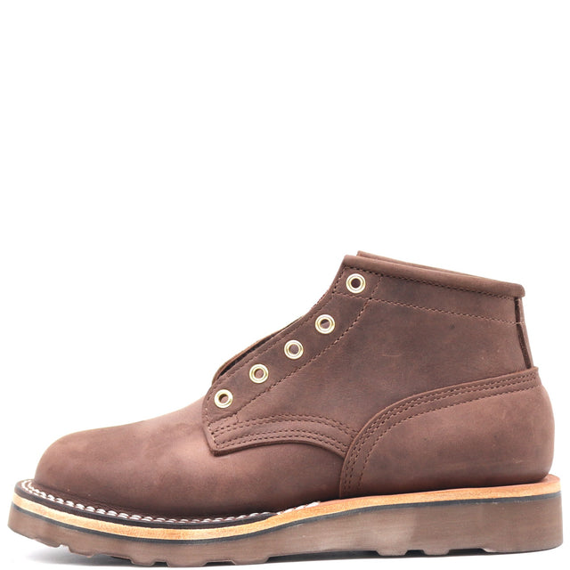 A brown suede lace-up ankle boot with silver metal eyelets, a tan midsole, and a brown outsole, shown from a side profile on a white background.
