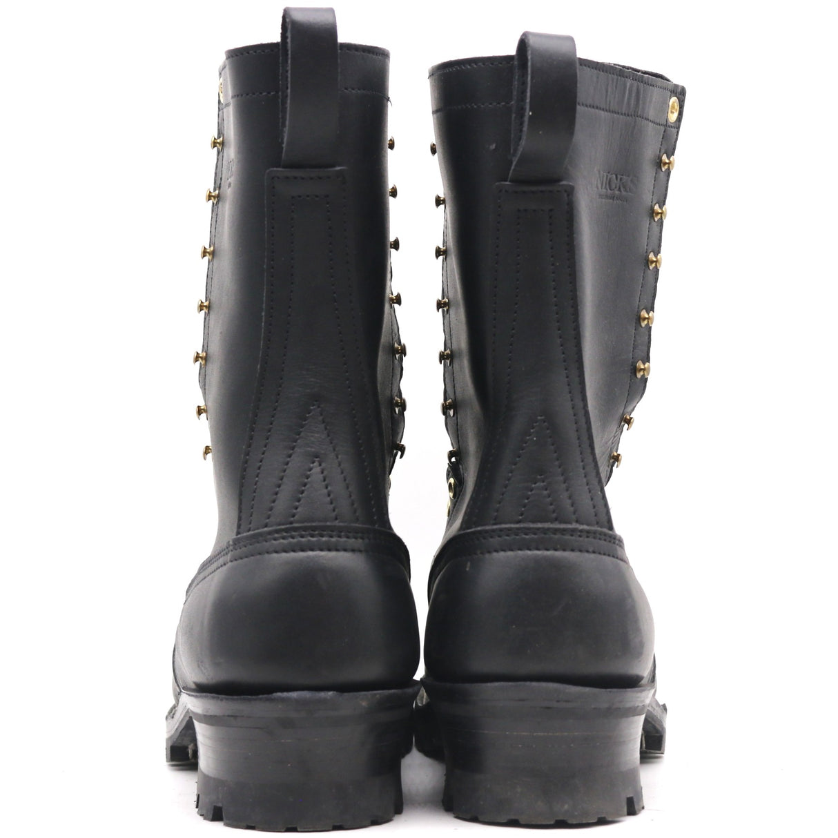 A pair of black leather mid-calf boots with gold-tone metal studs and laces, shown from the back against a white background.