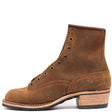 A brown suede lace-up ankle boot with a stacked leather heel, shown from a side profile on a white background.