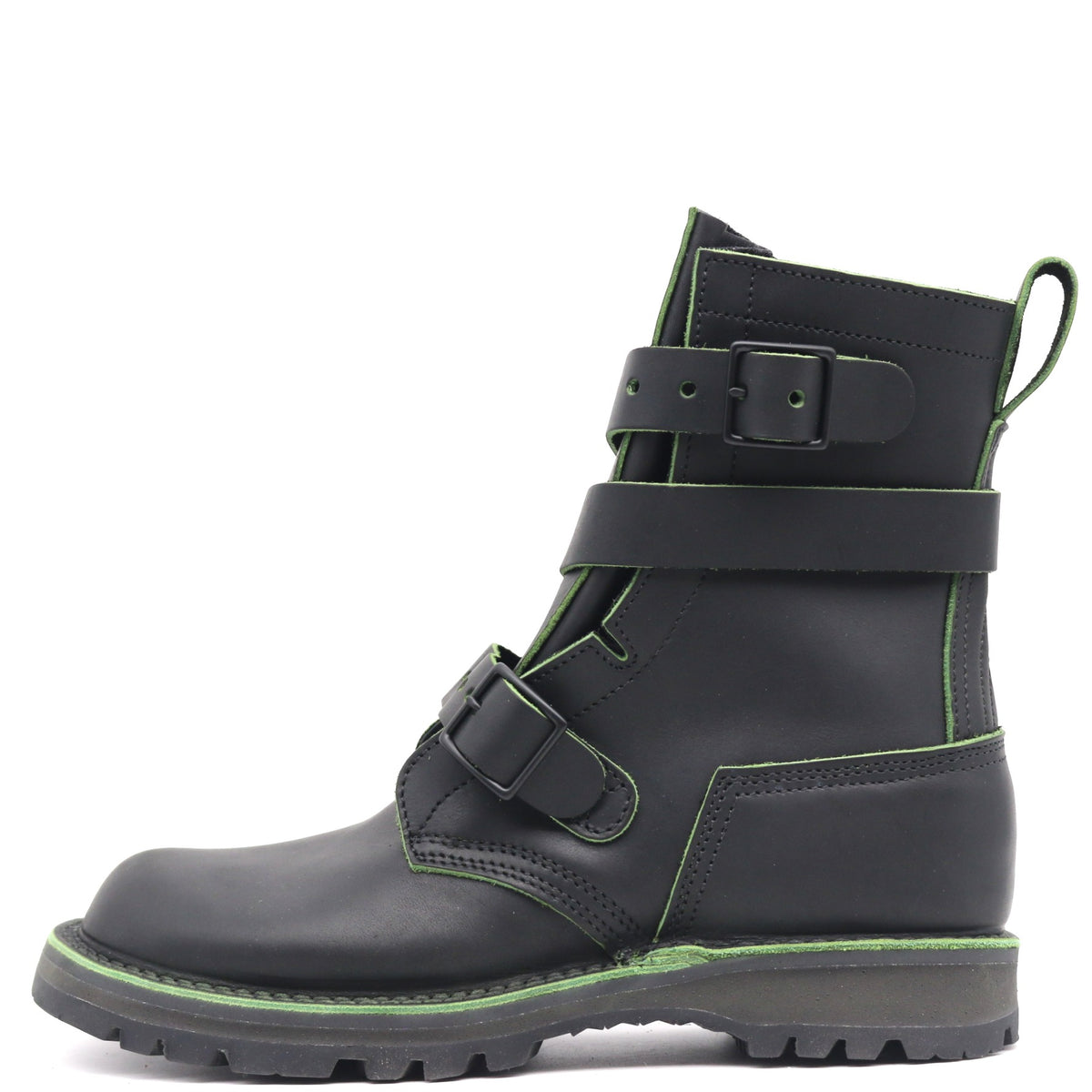 A black leather ankle boot with multiple black buckle straps and bright green contrast stitching, shown from a side profile on a white background.