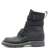 A black leather ankle boot with multiple black buckle straps and bright green contrast stitching, shown from a side profile on a white background.