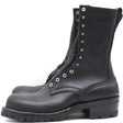 A pair of black leather lace-up boots with brass eyelets and studs, shown from a side profile view against a white background.