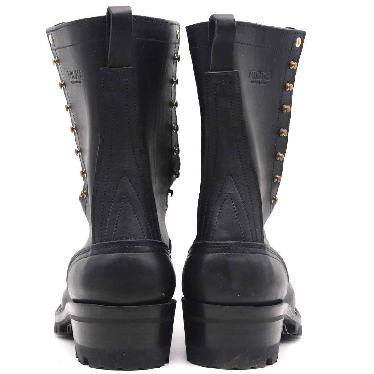 A pair of black leather lace-up boots with brass eyelets and studs, shown from the back against a white background.