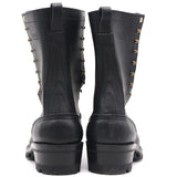 A pair of black leather lace-up boots with brass eyelets and studs, shown from the back against a white background.