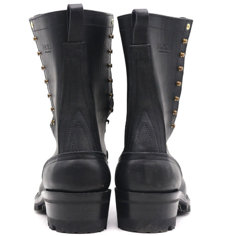 A pair of black leather lace-up boots with brass eyelets and studs, shown from the back against a white background.