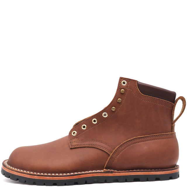 Zero Drop brown boot with padded top and brass hardware in front of a white background.