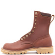 Brown leather boot with padded top, comfort flex notches, brass hardware, and tan outsole in front of a white background.